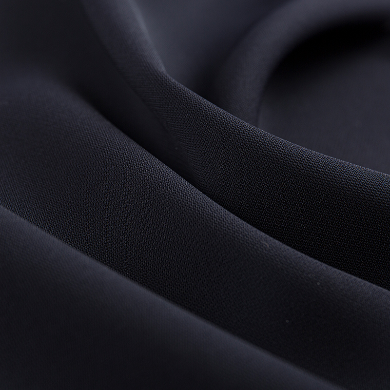 Tissu élastique à double couche à filaments composites