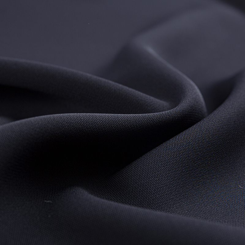 Tissu élastique à double couche à filaments composites