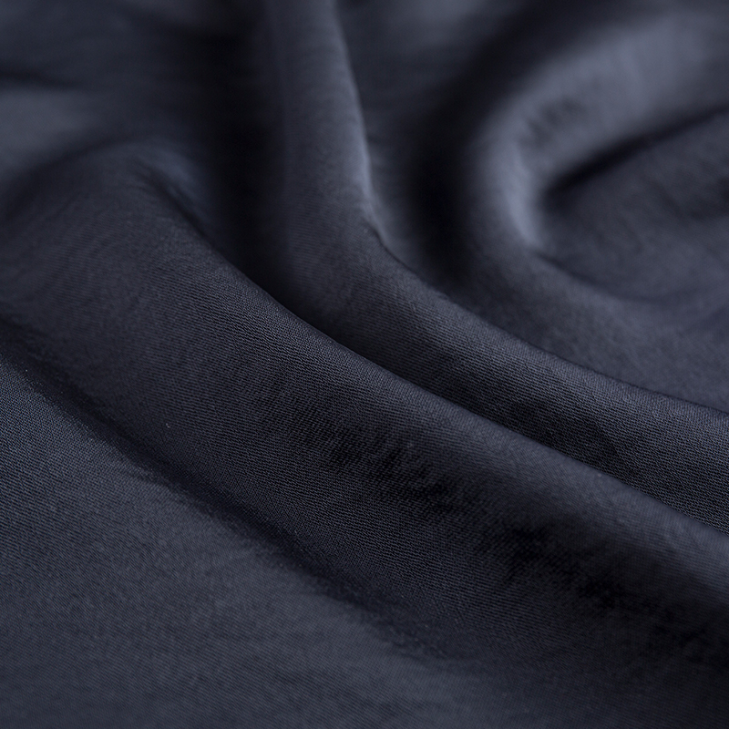 Tissu en satin extensible à trame filamentaire