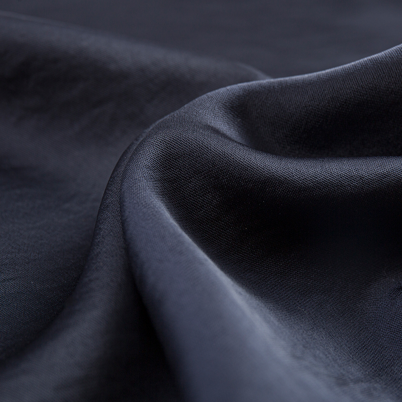 Tissu en satin extensible à trame filamentaire