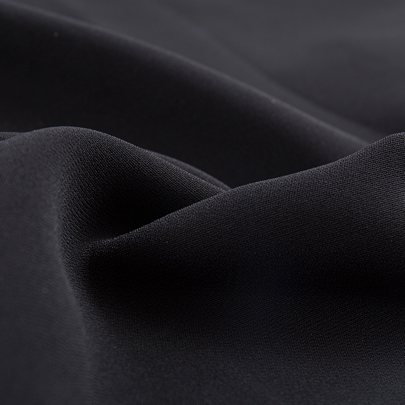 Tissu extensible à double couche en trame de filament composite