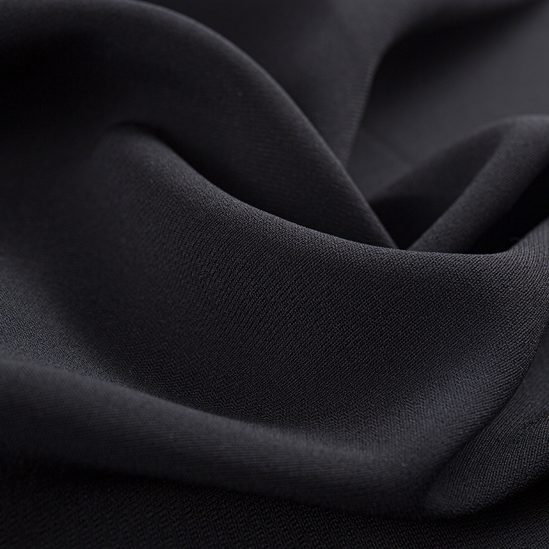 Tissu extensible à double couche en trame de filament composite