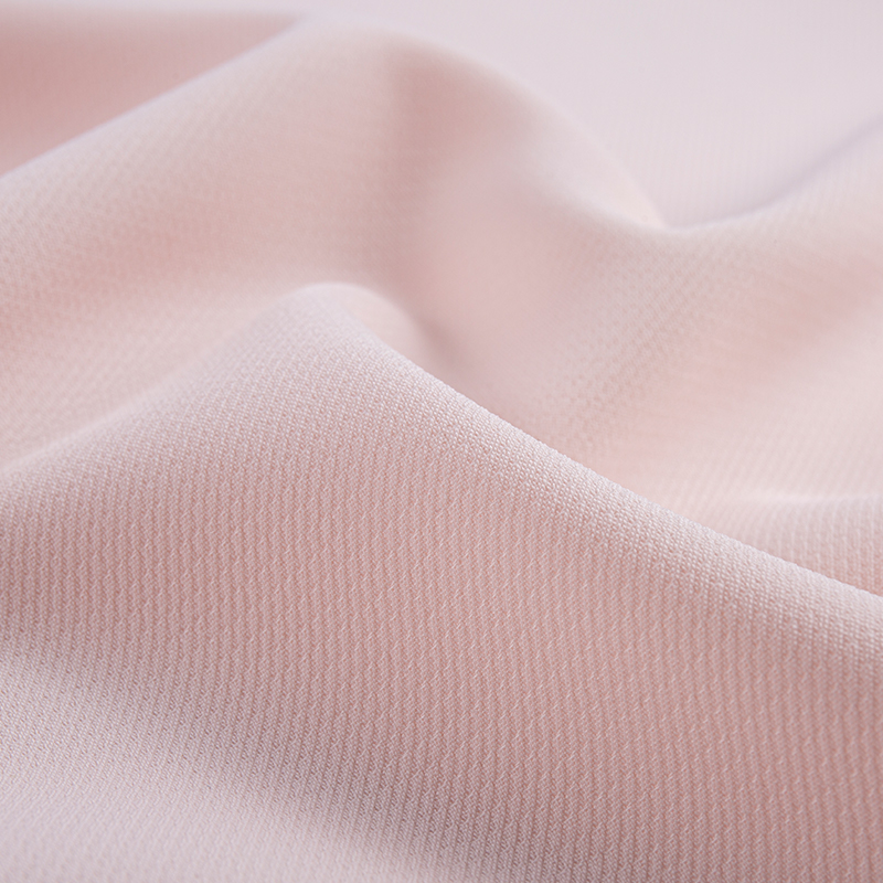 Tissu extensible à quatre voies à double couche à filaments composites