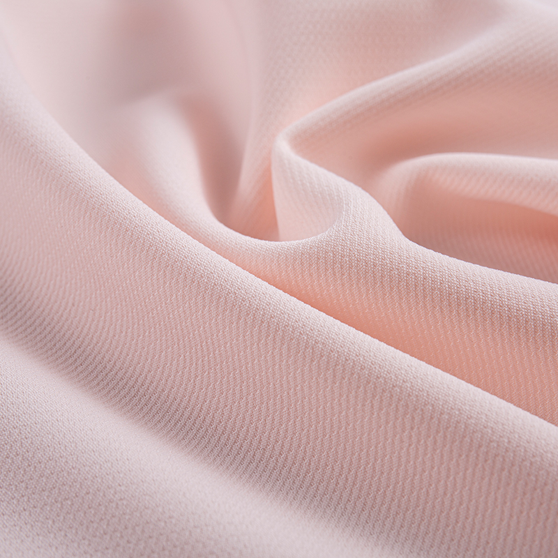 Tissu extensible à quatre voies à double couche à filaments composites